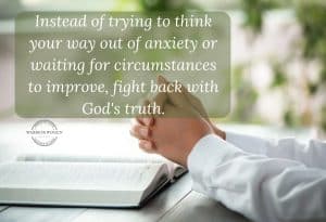 woman praying with an open Bible, finding peace from anxiety in Scripture