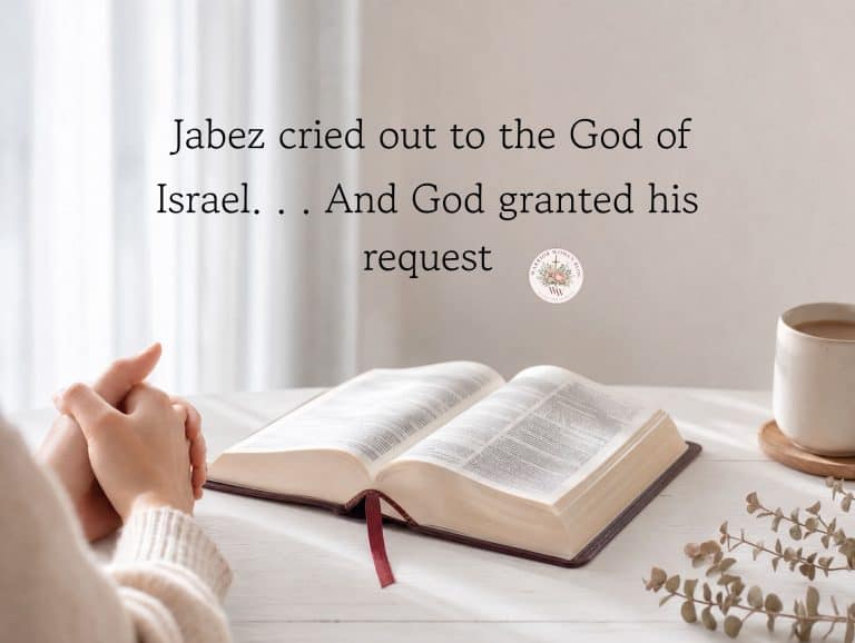An elegant graphic overlay featuring a prayer from 1 Chronicles 4:10 on a soft, warm background. A woman's hands are gently resting on an open Bible next to a cup of coffee, creating a quiet, reflective atmosphere.
